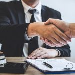 Corporate man shaking hands over finance loan approval